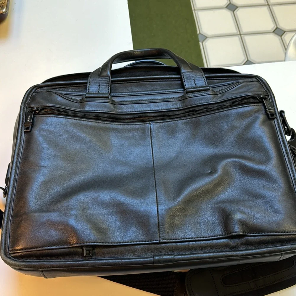 TUMi black leather computer briefcase carry-on VGC long strap multiple pockets